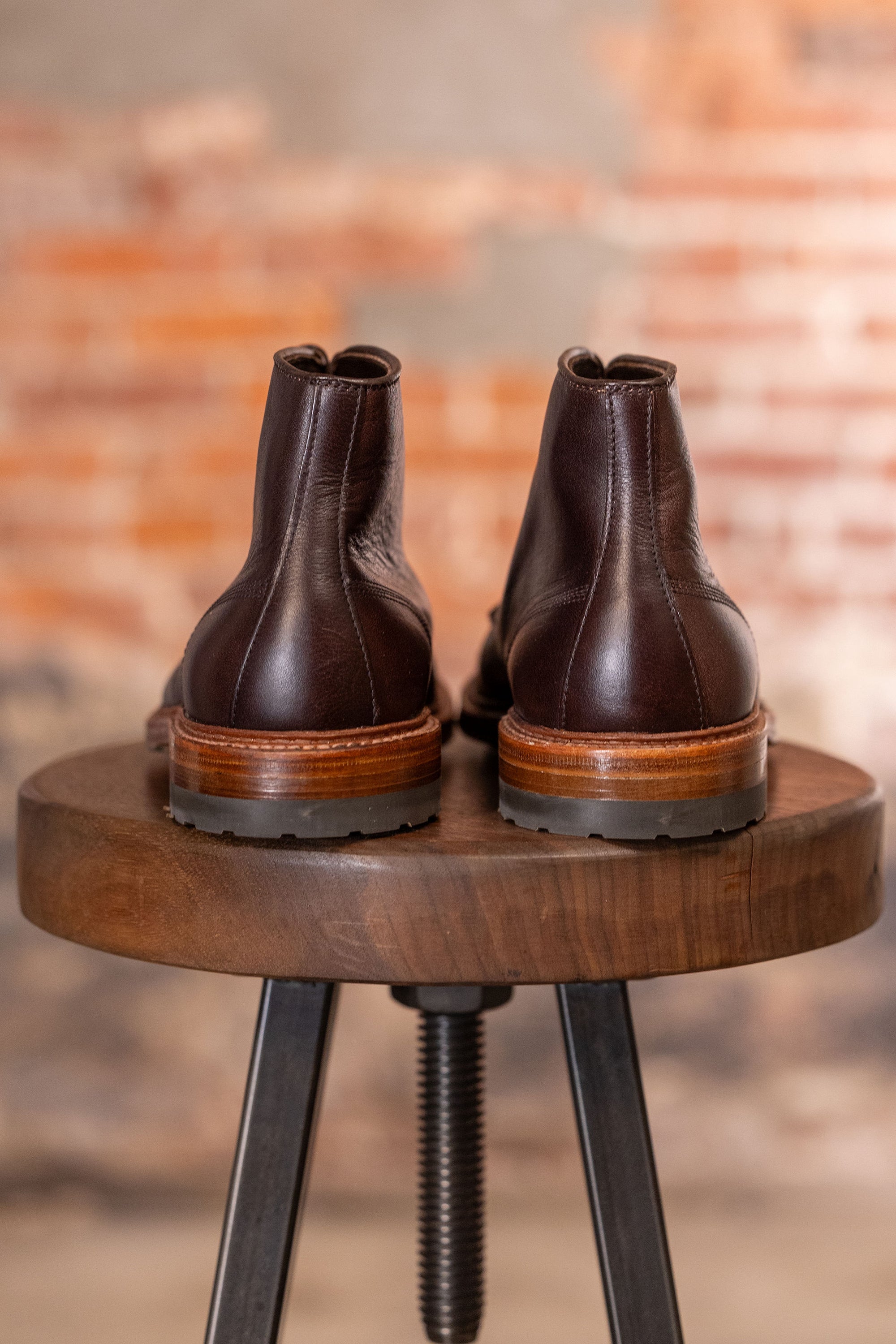 Brown leather cap toe boots back view