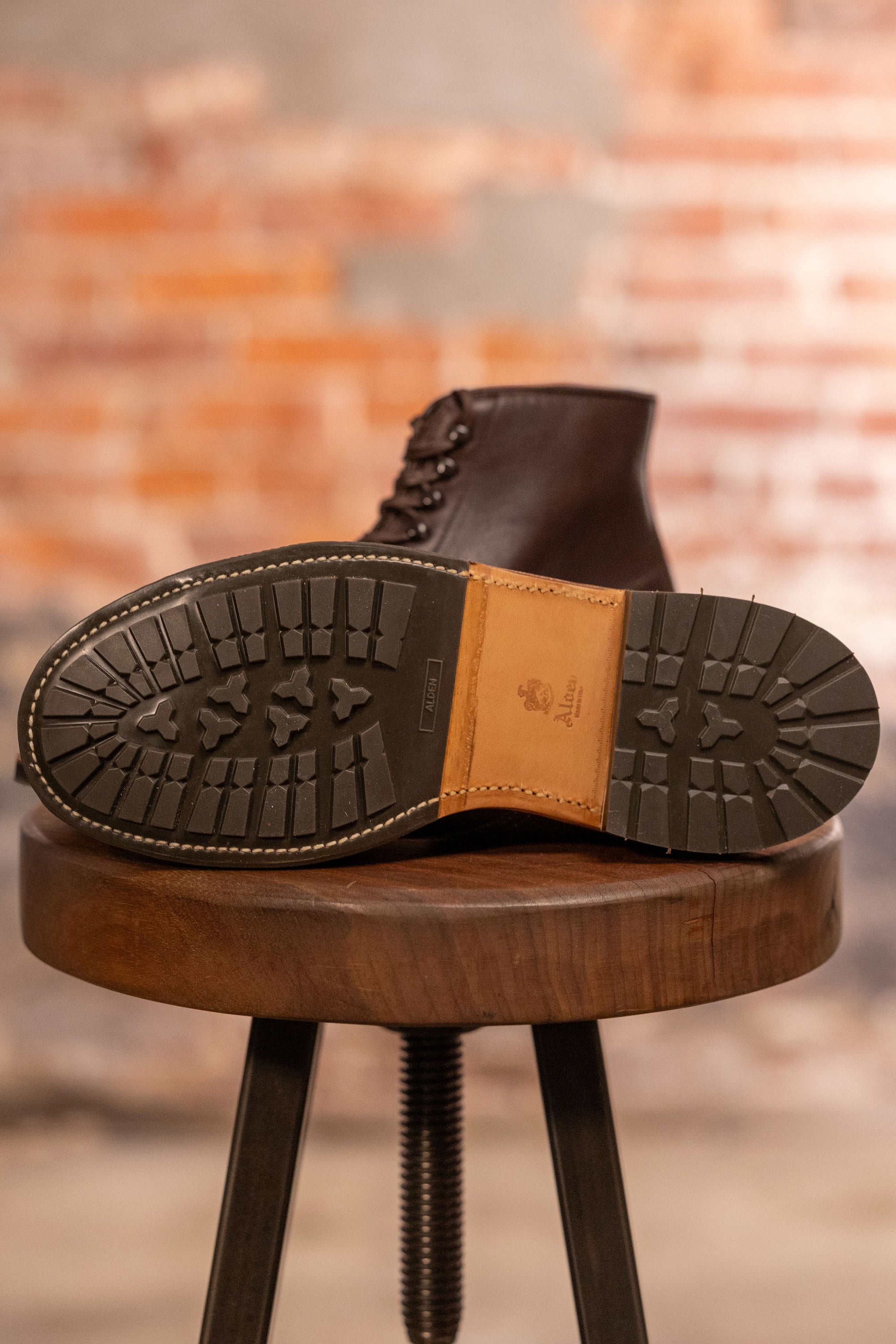 Brown leather cap toe boots view of traction on sole