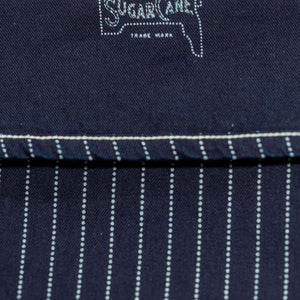 Navy striped fatigue pocket pants close up on cuffed hem with navy interior and Sugar Casne branding