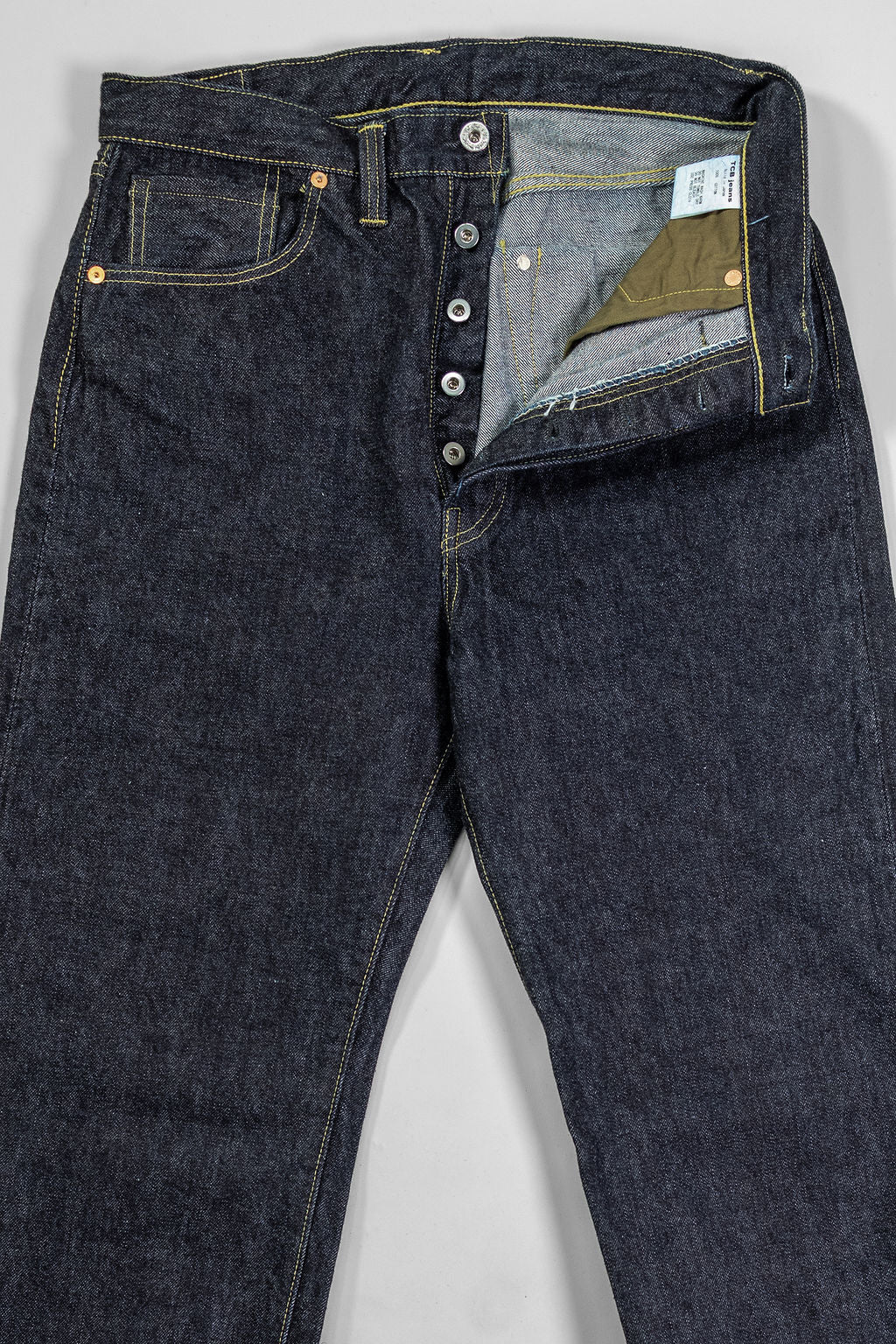 TCB Jeans S40's Jeans - One Wash. laid on back with buttons undone