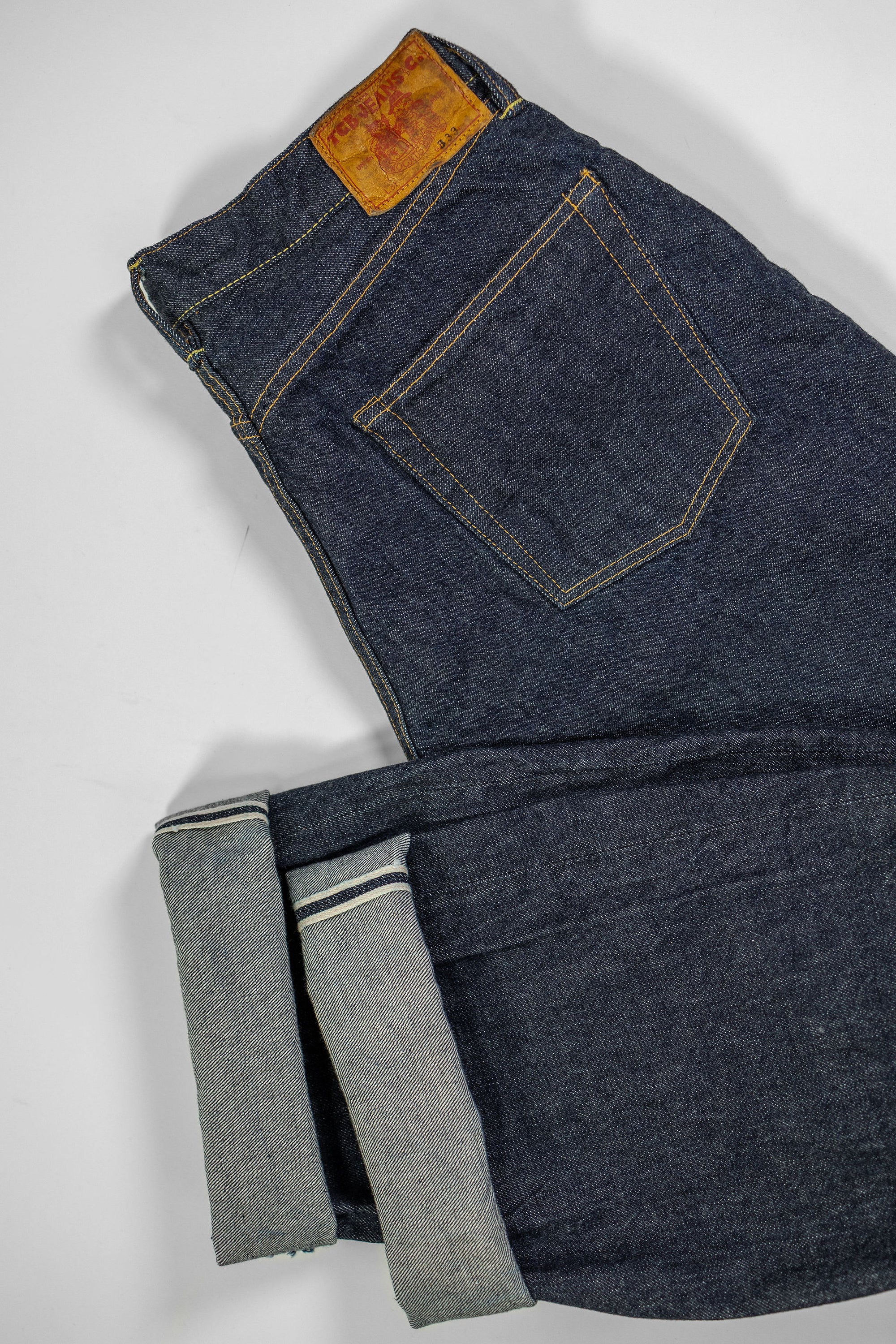 TCB Jeans Baggy 50's Jeans - 13.5oz Denim One Wash. laid flat showing cuff