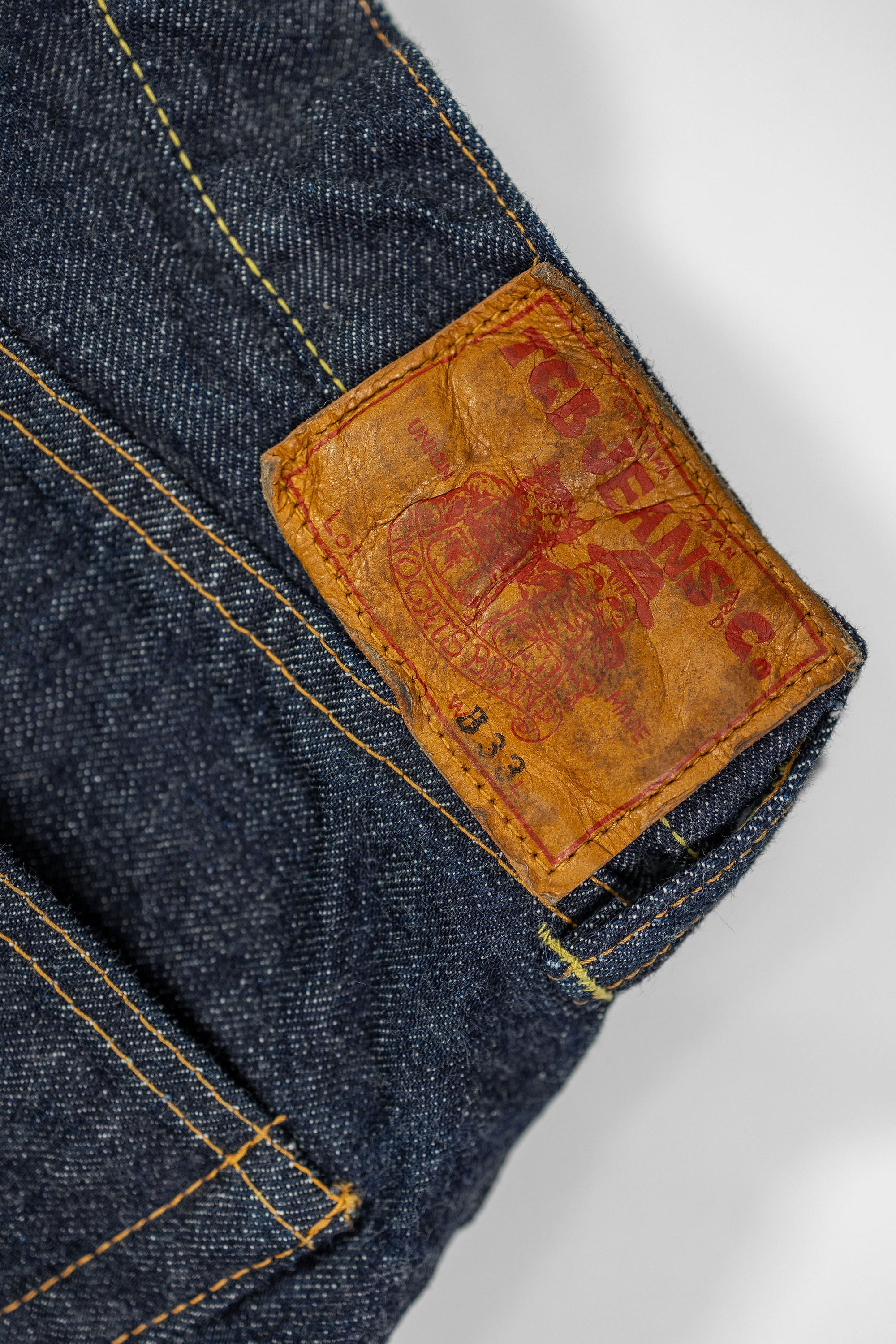 TCB Jeans Baggy 50's Jeans - 13.5oz Denim One Wash. close up of leather patch