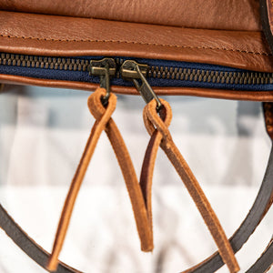 Bleu de Chauffe Folder Business Bag - Amber Brown. detail shot of zipper leather straps