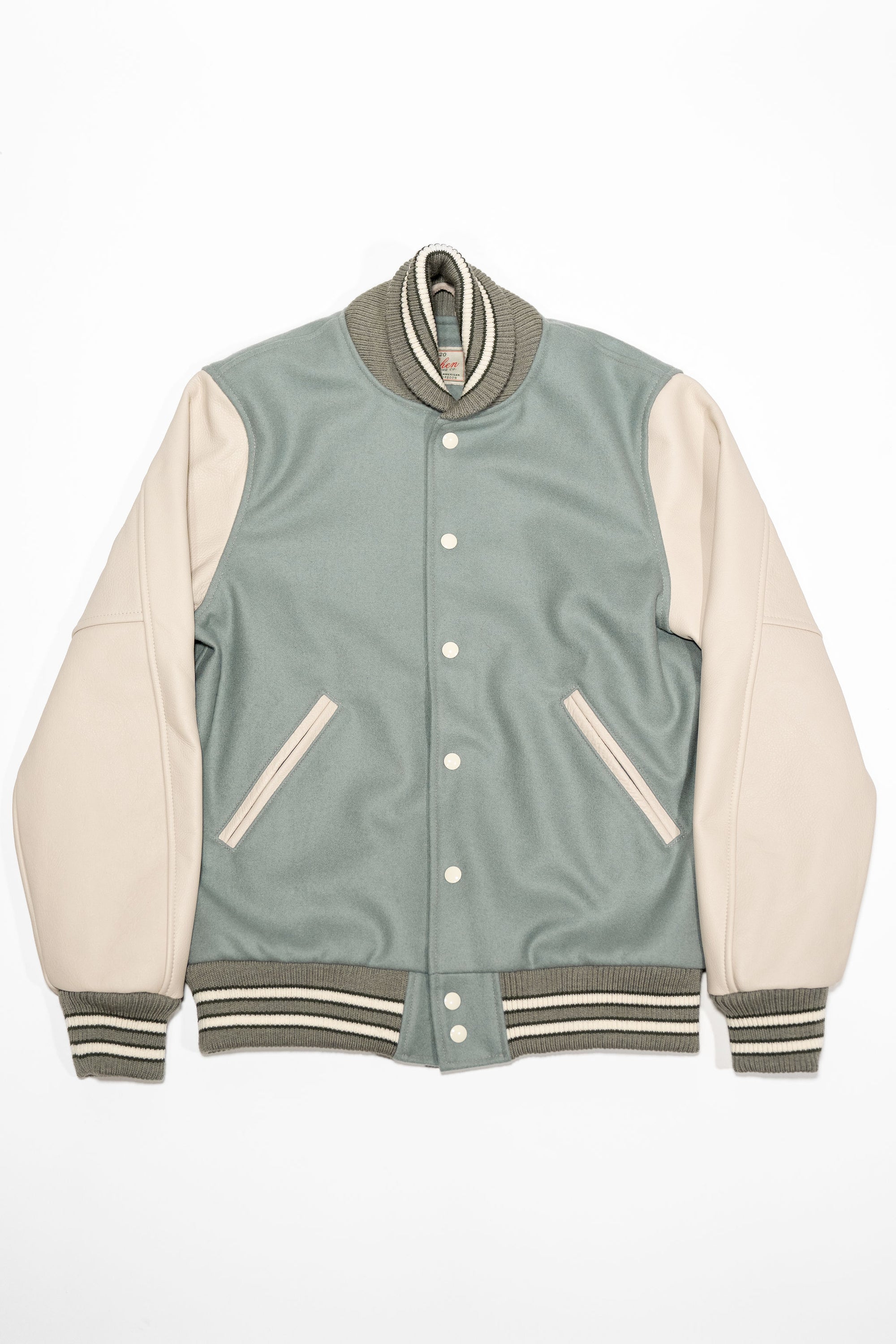 Dehen 1920 Varsity Jacket - Reef Wool / Milk Leather. laid on back