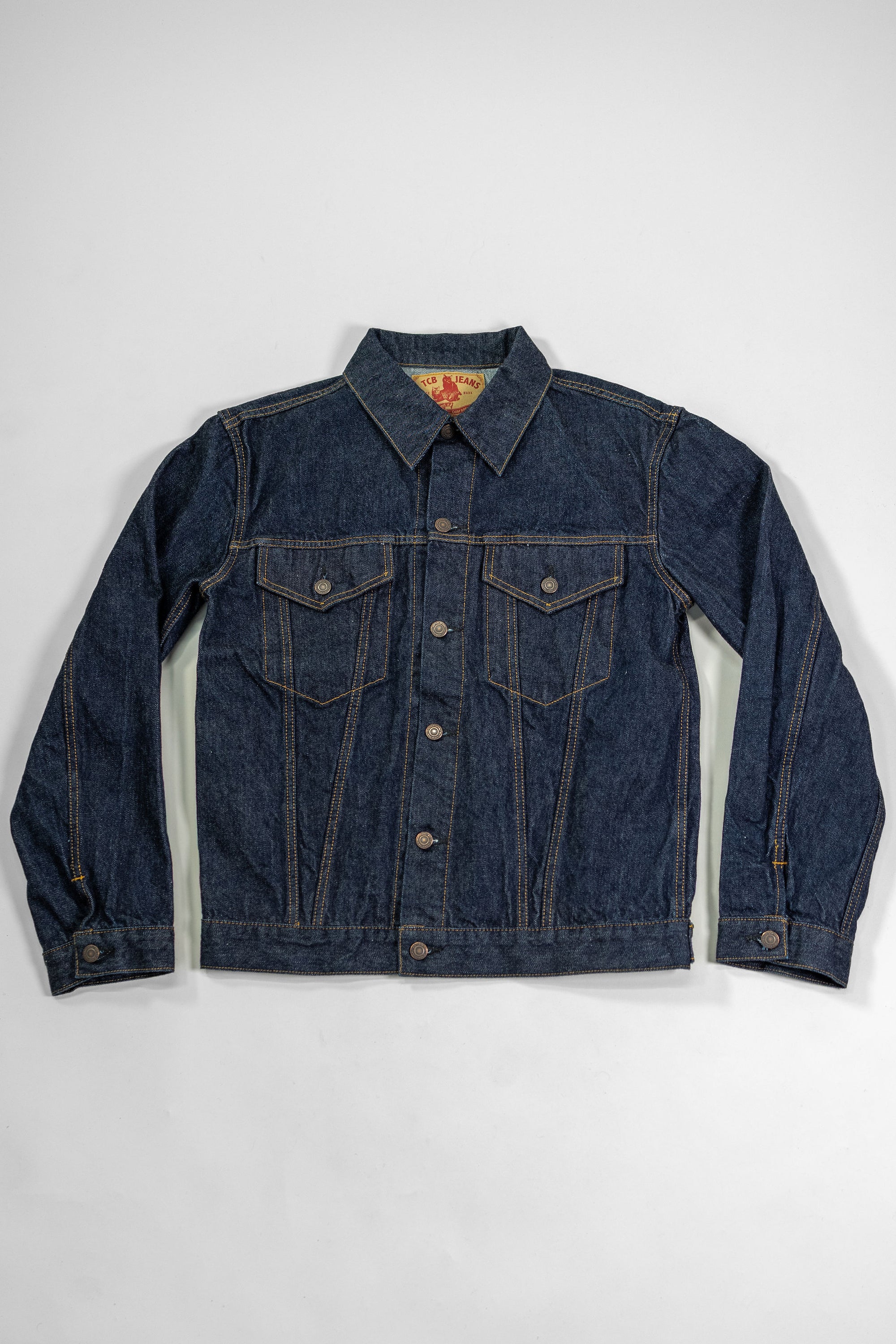 TCB Jeans 60's Trucker Jacket - One-Wash. laid on back