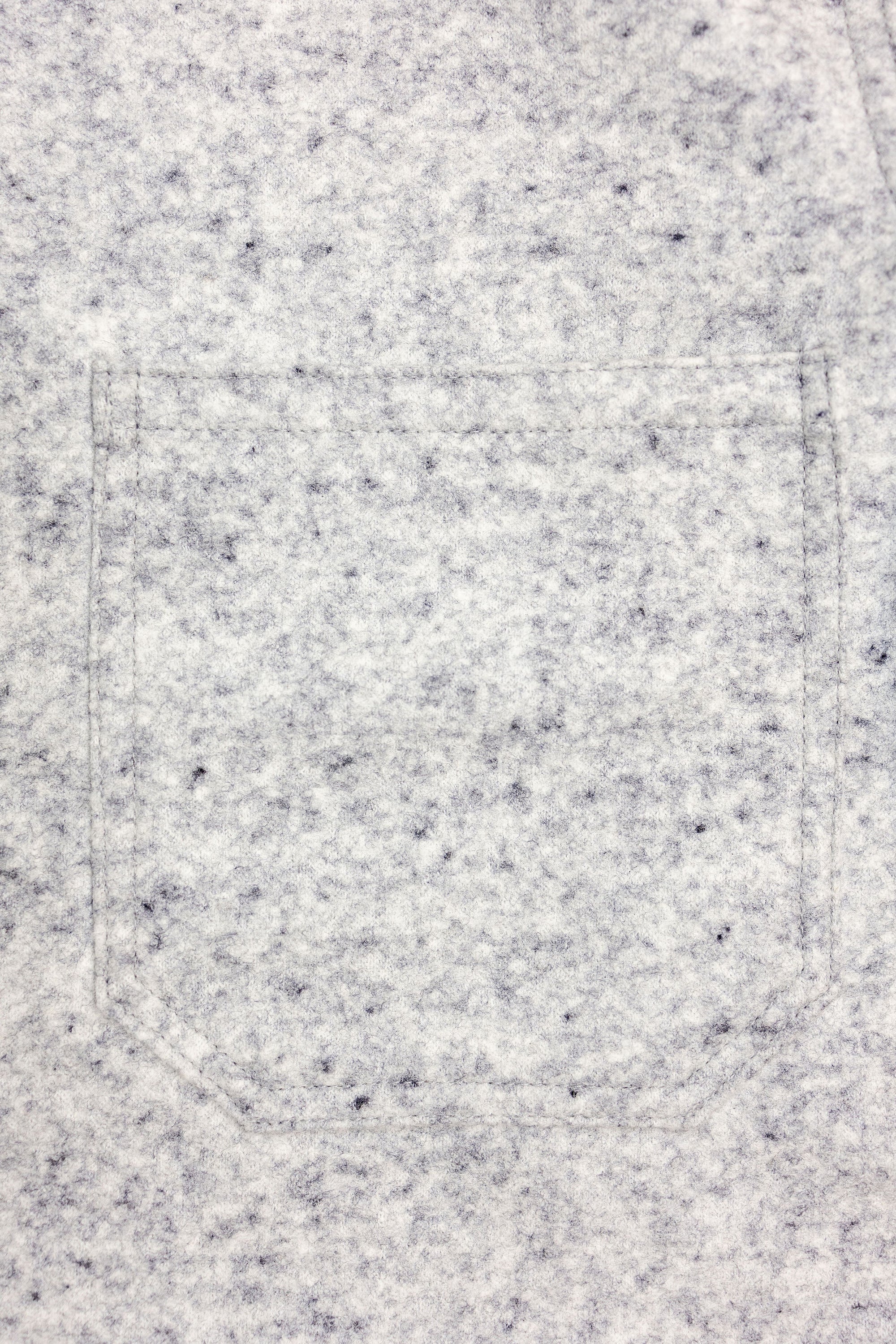 Dehen 1920 Chore Coat - Natural & Navy Heather Wool. close up of front pocket detail