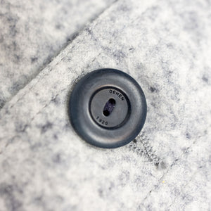 Dehen 1920 Chore Coat - Natural & Navy Heather Wool. close up shot of button branding