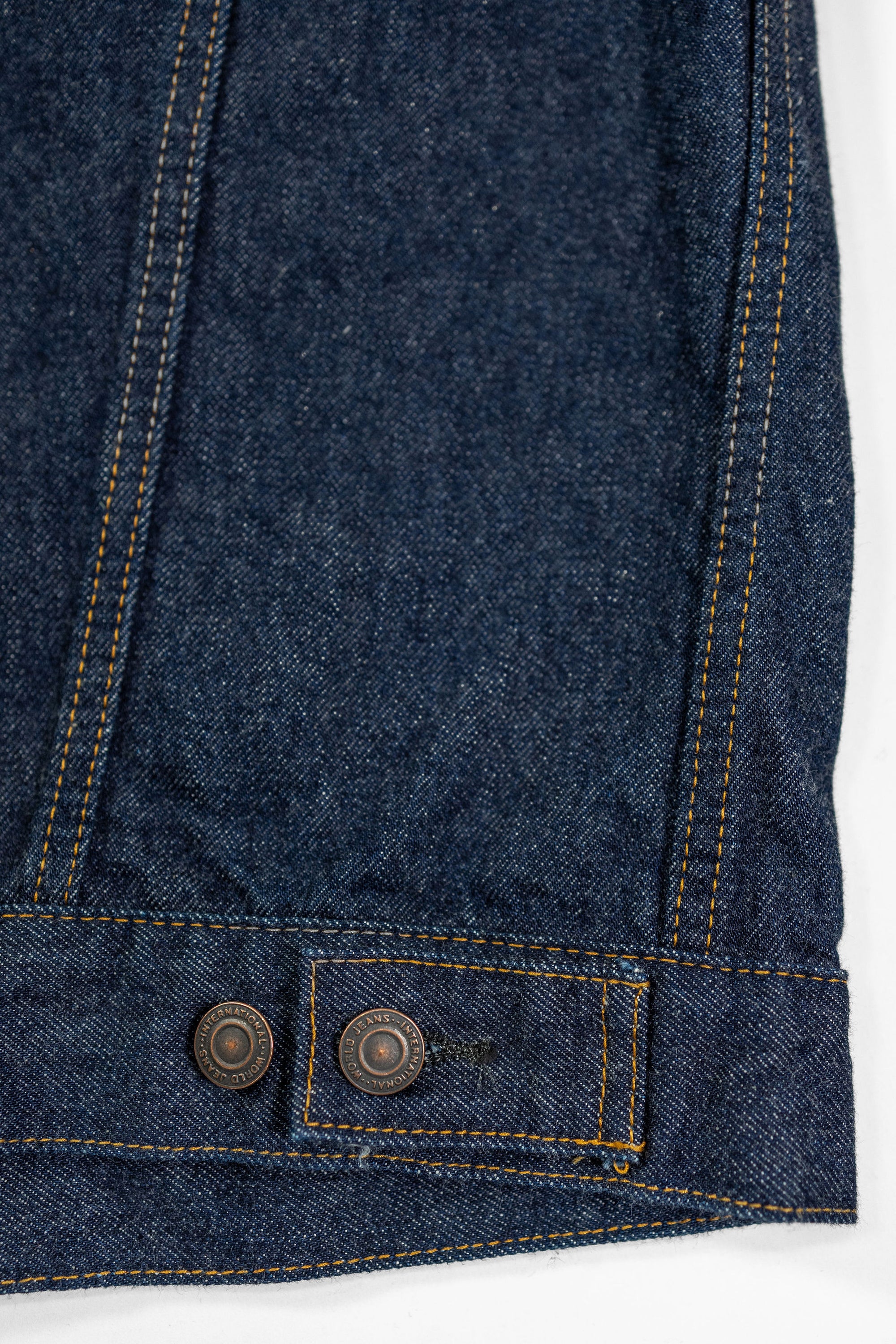 TCB Jeans 60's Trucker Jacket - One-Wash. close up of back bottom button detail