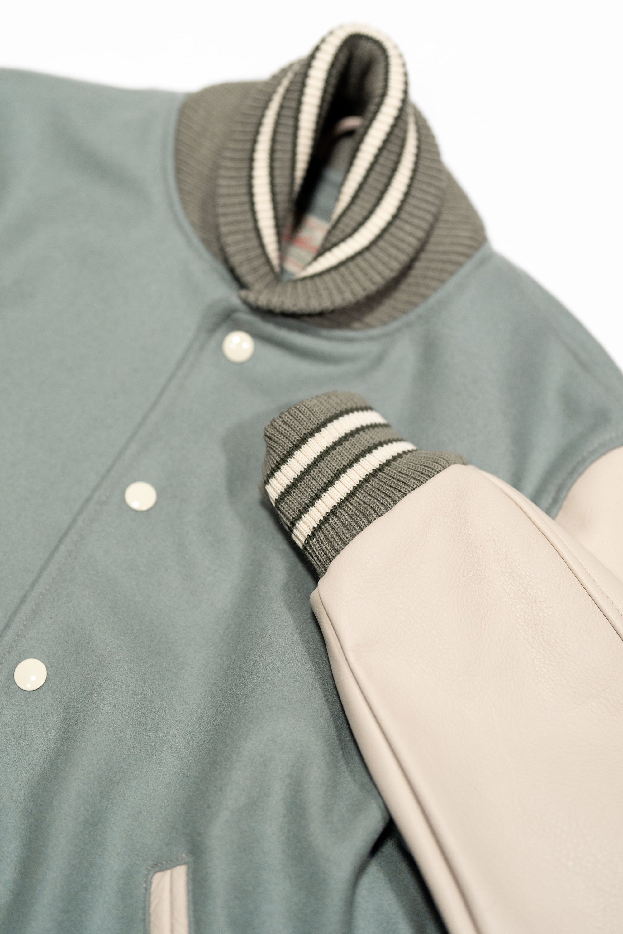 Dehen 1920 Varsity Jacket - Reef Wool / Milk Leather. close up of sleeve detail