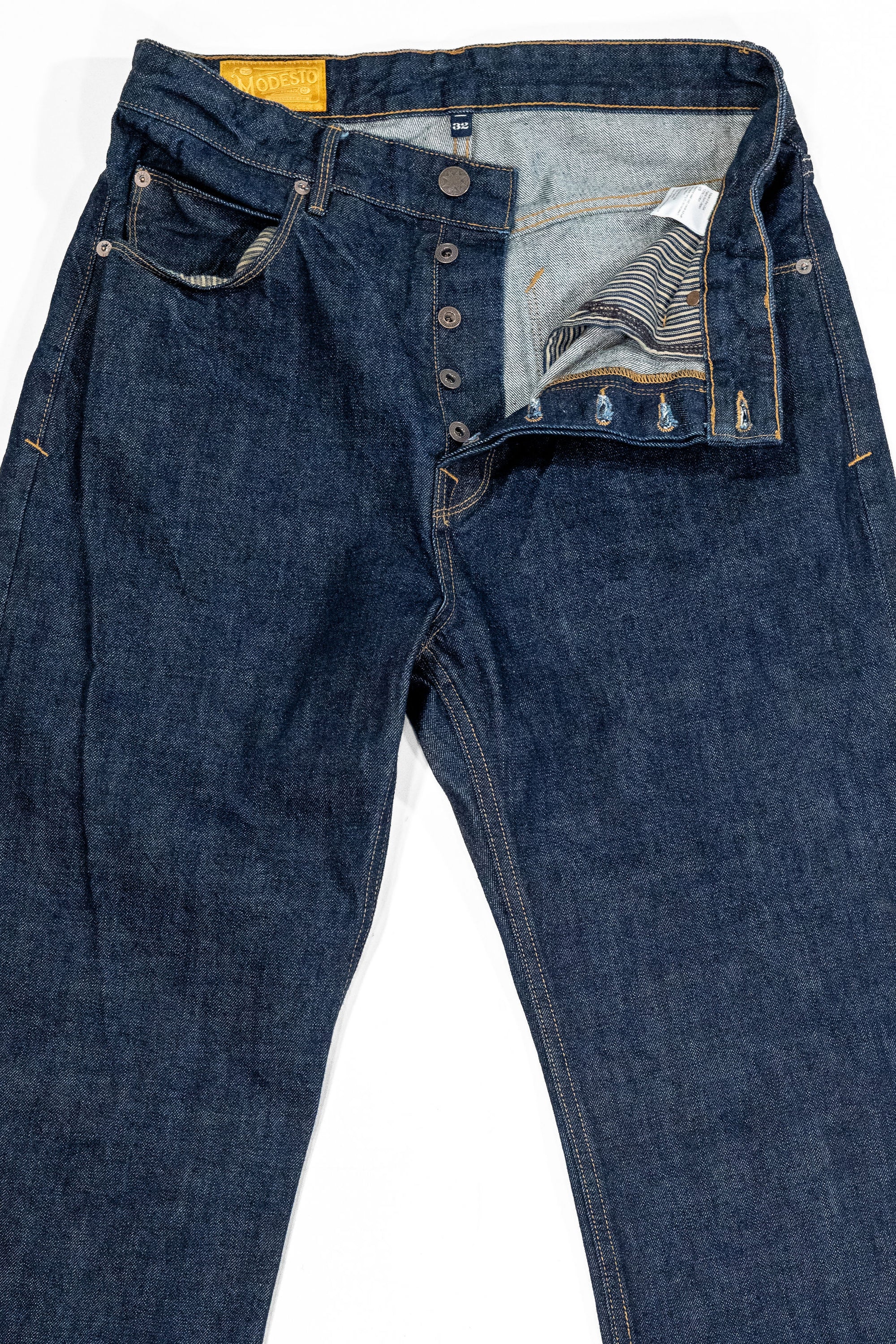 Freenote Cloth Modesto - 14oz 50's Denim Rinsed. laid on back with button fly open