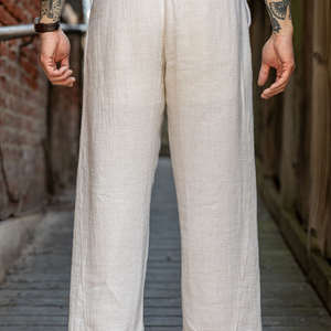 Hansen Garments Bobby Wide Pleated Trousers - Off White Gauze - model shot - waist down - back facing
