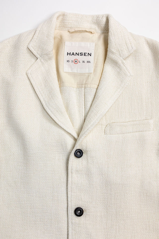 Hansen Garments Charlie Three Button Blazer - Off White Gauze - product shot - close up detail of tag, closed jacket,  and buttons - white background