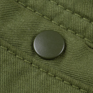 Olive mid length shorts back view laying flat closeup on snap pocket