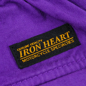 Purple mid length shorts back view laying flat closeup on black/yellow Iron Heart logo