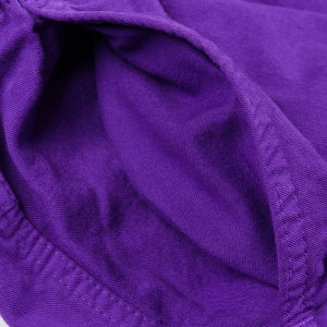 Purple mid length shorts laying flat closeup on side pocket