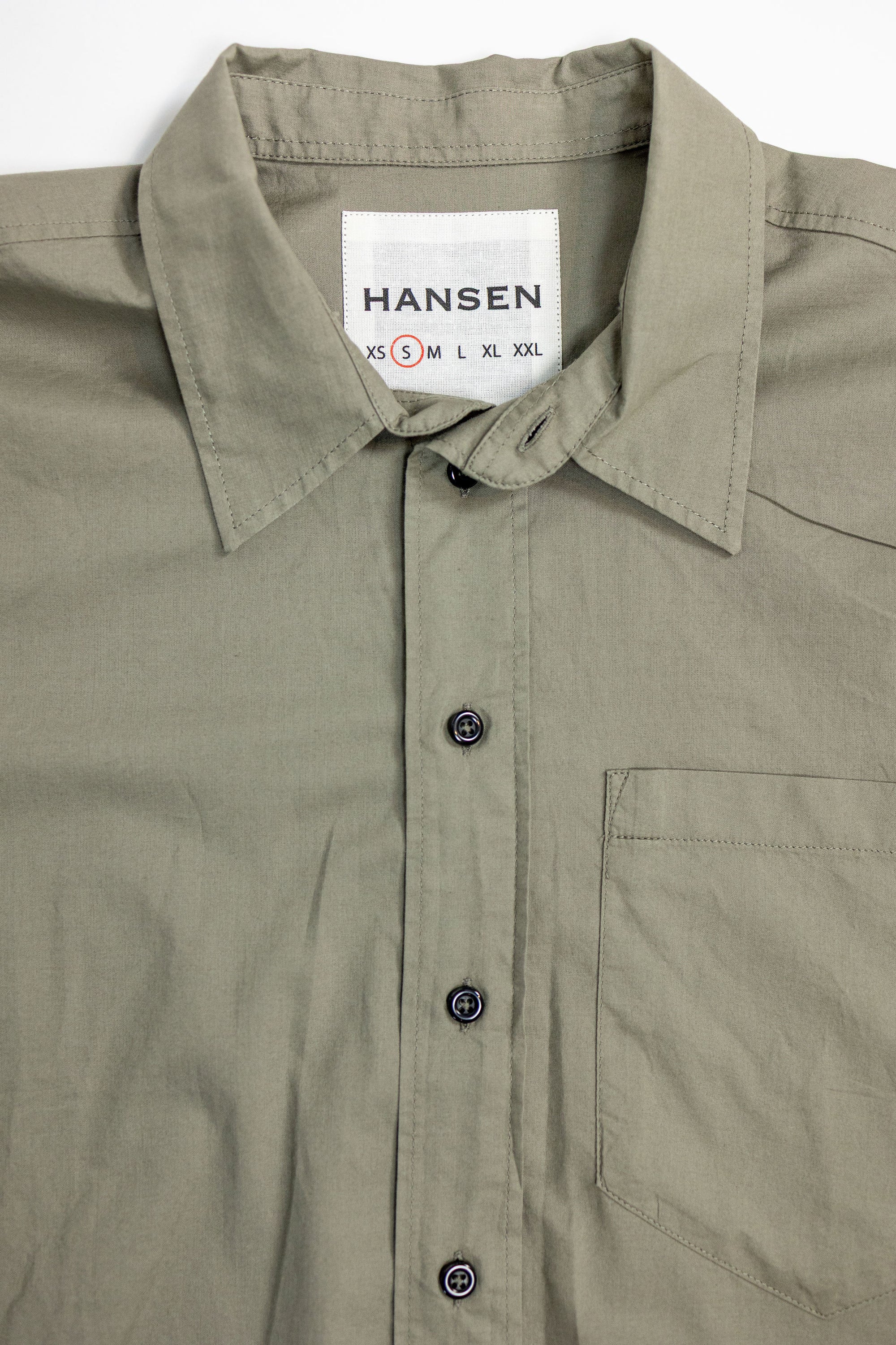Hansen Garments Reidar Short Sleeve Shirt - Dry Oregano - product shot - front facing - white background - close up of collar, buttons, and brand tag