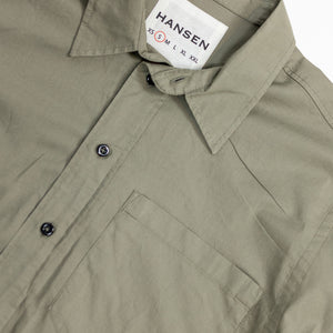 Hansen Garments Reidar Short Sleeve Shirt - Dry Oregano - product shot - front facing - white background - close up of collar, buttons, brand tag, and pocket