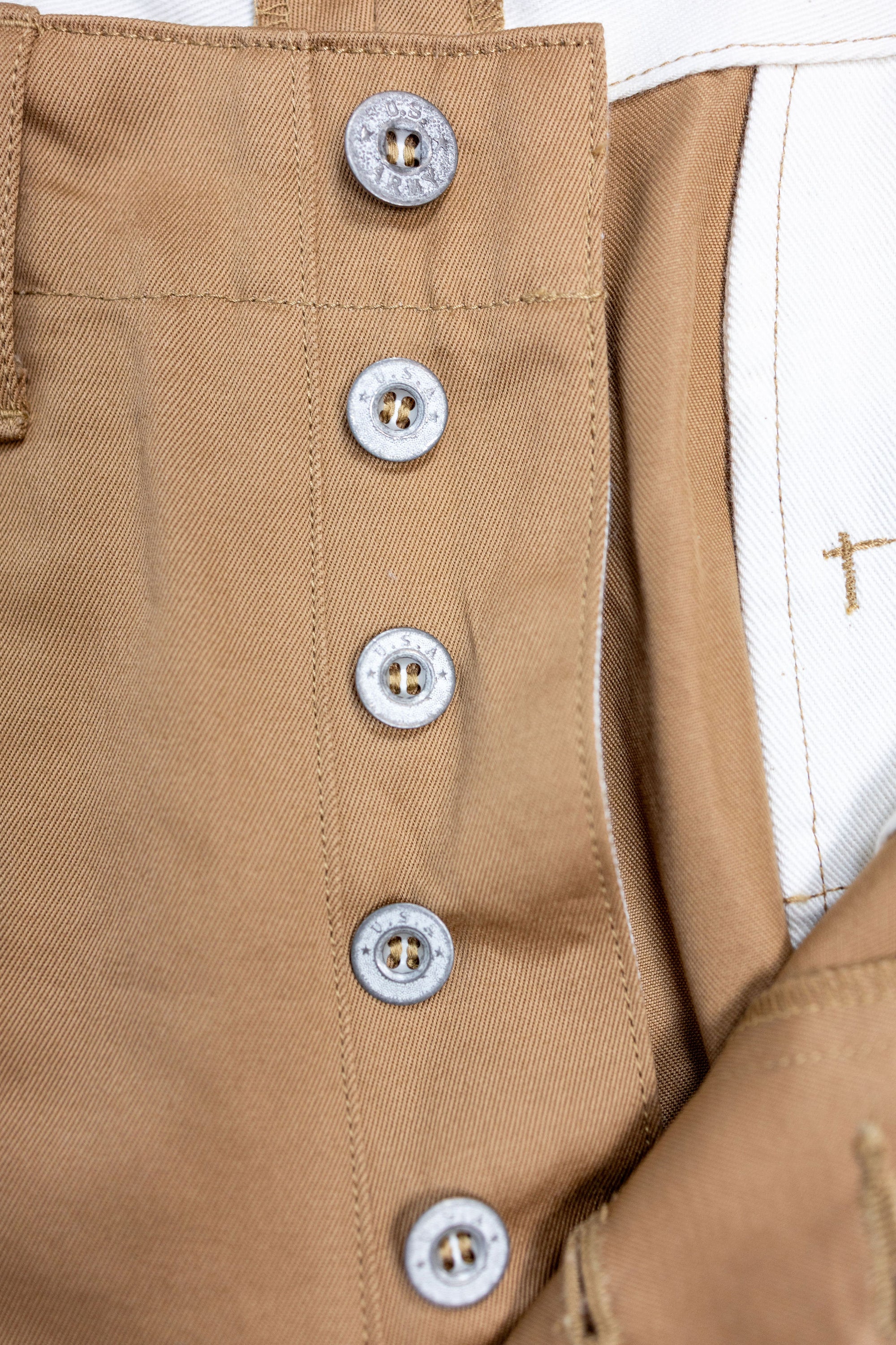Buzz Rickson's M43035 Early Military Chinos 1945 Model in Camel - Laying flat, close up on buttons