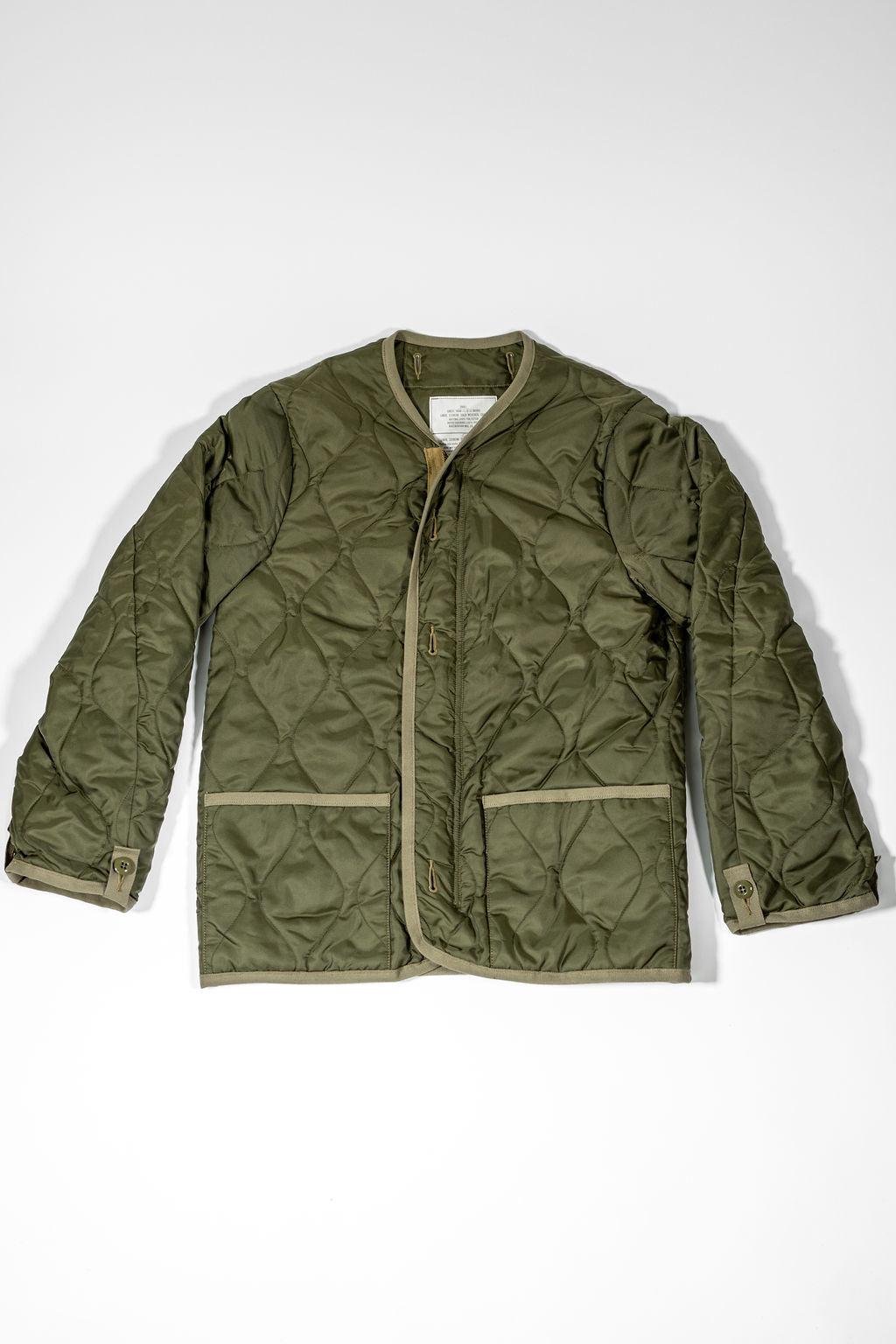 Buzz Rickson's BR15754 Type M-65 Liner in Olive - Laying flat, facing front