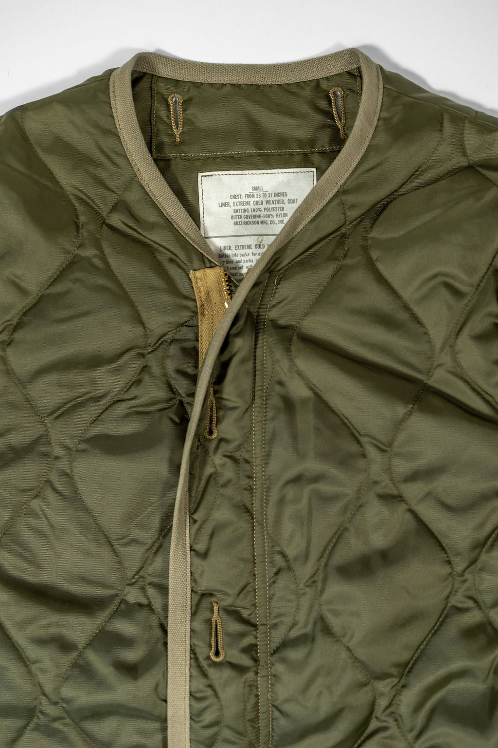 Buzz Rickson's BR15754 Type M-65 Liner in Olive - Laying flat, facing front close-up