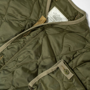 Buzz Rickson's BR15754 Type M-65 Liner in Olive - Laying flat, front close-up with sleeve cuff