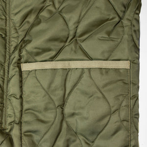 Buzz Rickson's BR15754 Type M-65 Liner in Olive - Laying flat, close-up on pocket