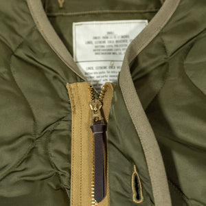 Buzz Rickson's BR15754 Type M-65 Liner in Olive - Laying flat, close-up on zipper