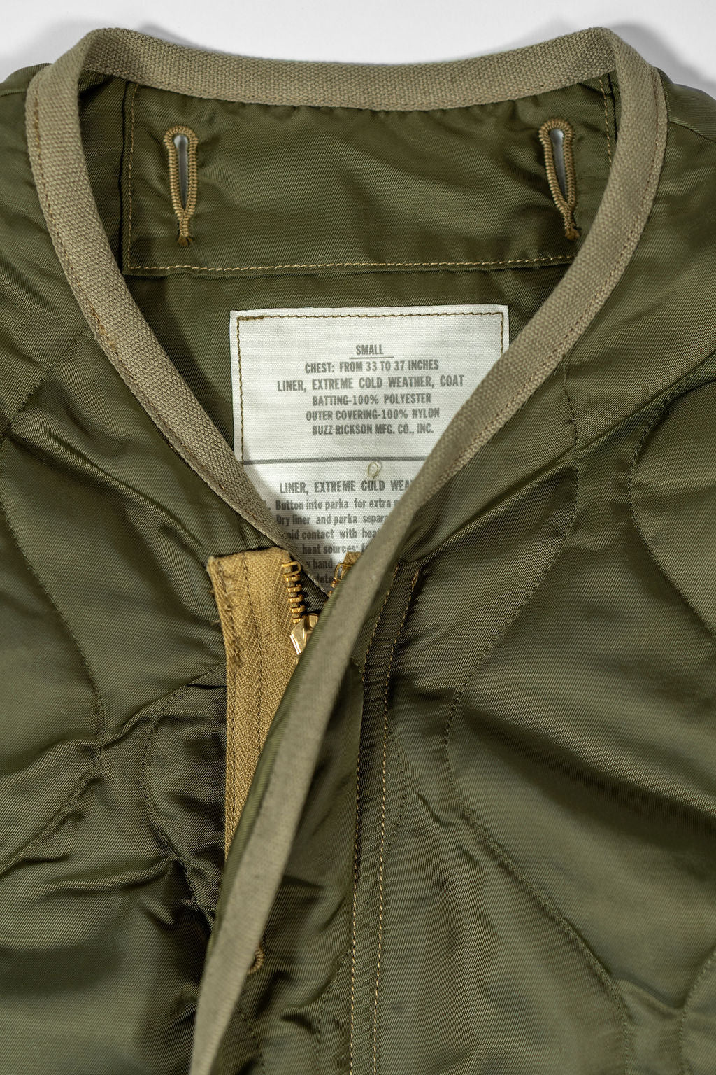 Buzz Rickson's BR15754 Type M-65 Liner in Olive - Laying flat, close-up on label