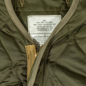Buzz Rickson's BR15754 Type M-65 Liner in Olive - Laying flat, close-up on label