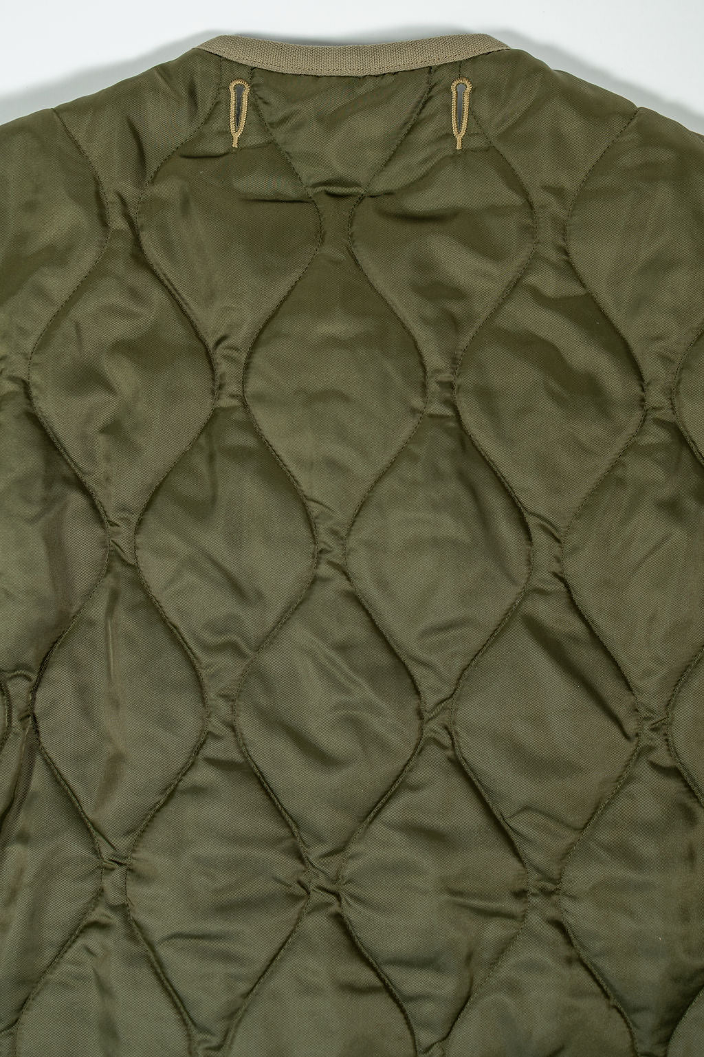 Buzz Rickson's BR15754 Type M-65 Liner in Olive - Laying flat, close-up on back