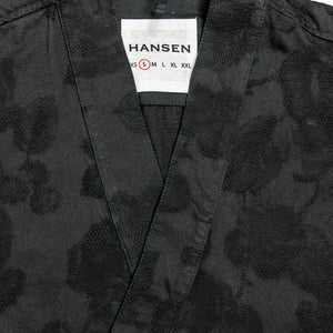 Hansen Garments Roman Loose Cut Jacket - Black Flowers - product shot - front facing - close up -  detail of brand tag and collar - white background