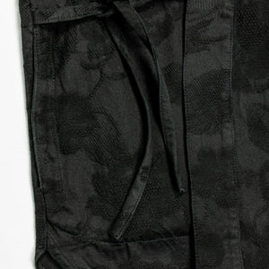 Hansen Garments Roman Loose Cut Jacket - Black Flowers - product shot - front facing - close up -  detail of fabric, bottom of jacket, and tie closure - white background