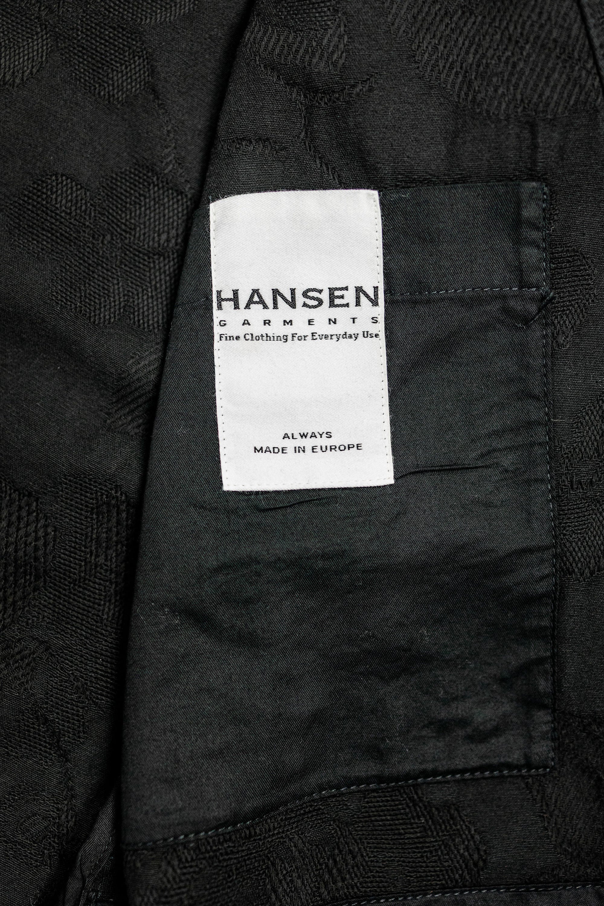 Hansen Garments Roman Loose Cut Jacket - Black Flowers - product shot - interior - close up -  detail of fabric and brand tag on jacket