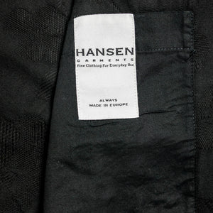 Hansen Garments Roman Loose Cut Jacket - Black Flowers - product shot - interior - close up -  detail of fabric and brand tag on jacket