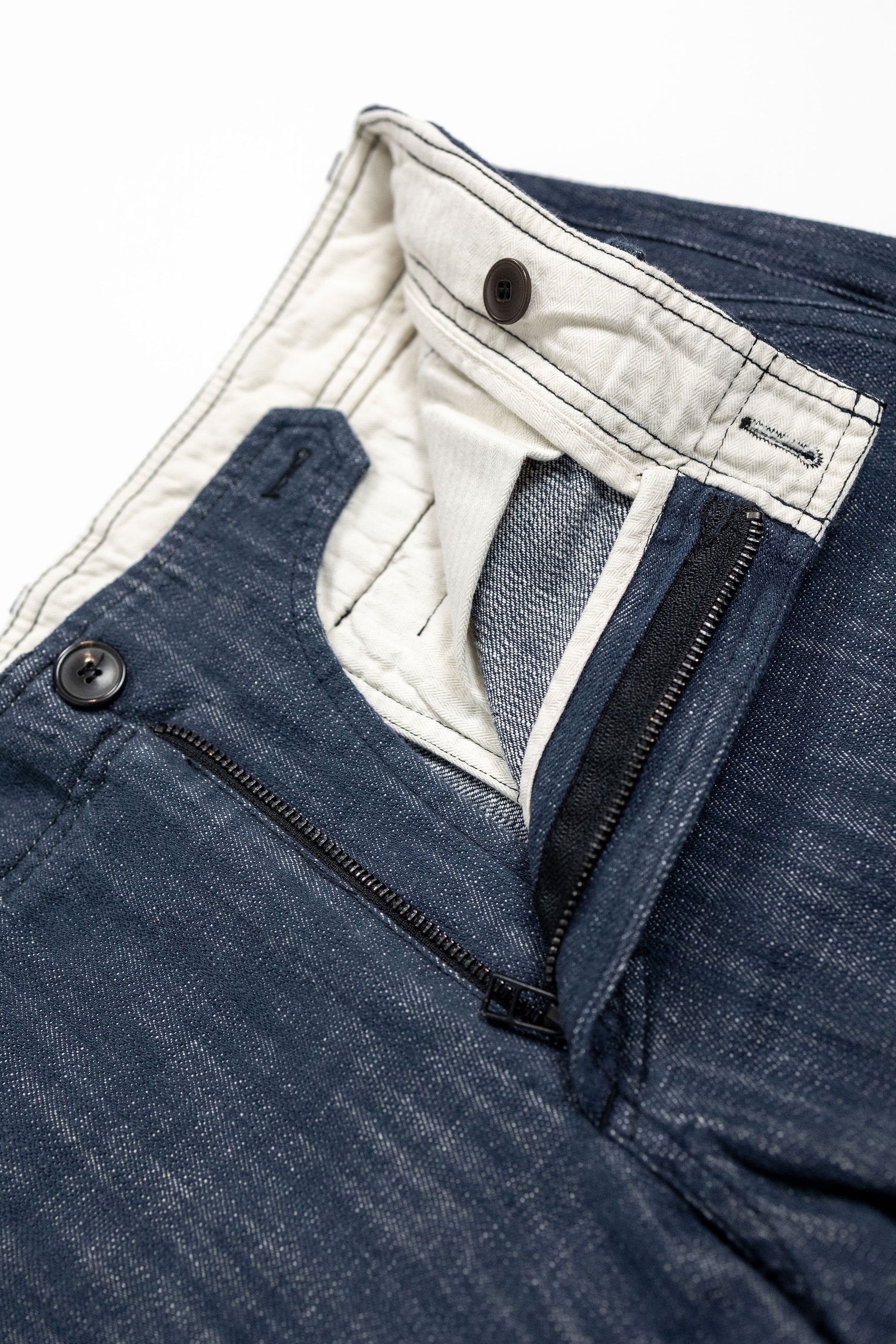 Hansen Garments Trygve Wide Cut Cropped Trousers - Denim Blue - product shot - front facing - white background - pants zipped open - close up - detail