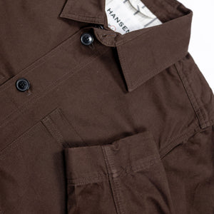 Hansen Garments Bendik Workwear Jacket - Chestnut - product shot - front facing - white background - close up detail of collar, buttons, pocket, and sleeve