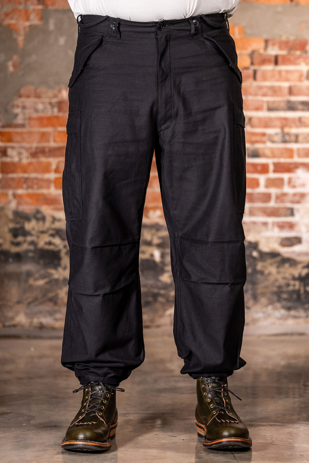 Buzz Rickson's BR42592 William Gibson Black M-51 Trousers - On model, facing camera with ankle ties cinched