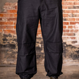 Buzz Rickson's BR42592 William Gibson Black M-51 Trousers - On model, facing camera with ankle ties cinched
