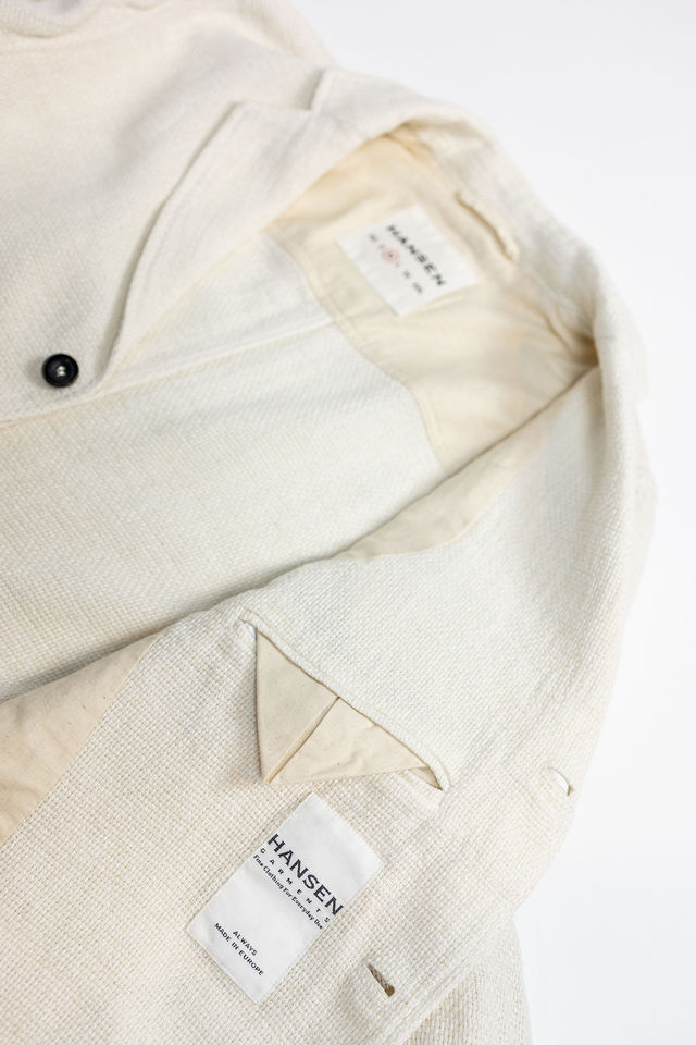Hansen Garments Charlie Three Button Blazer - Off White Gauze - product shot - close up detail of tag, open jacket, and inner pocket - white background