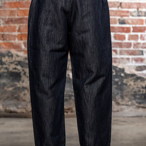 Hansen Garments Emir Loose Drawstring Pants - Navy Dobby - close up - waist down - brick background - back facing