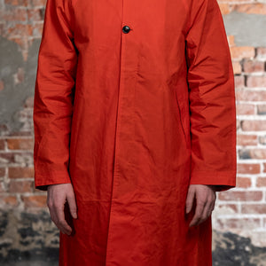 Hansen Garments Morten Long Coat - Waxed Orange on model from the front