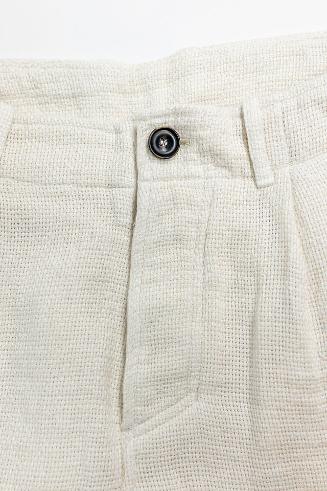 Hansen Garments Bobby Wide Pleated Trousers - Off White Gauze - product shot - close up - detail of button and fabric - white background