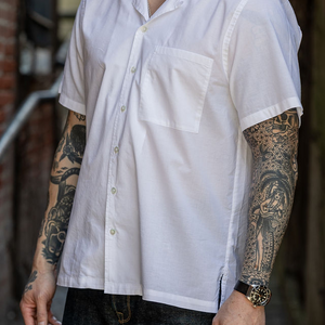 Hansen Garments Caleb Short Sleeve Cabana Shirt - White - model shot - side facing - alleyway backdrop