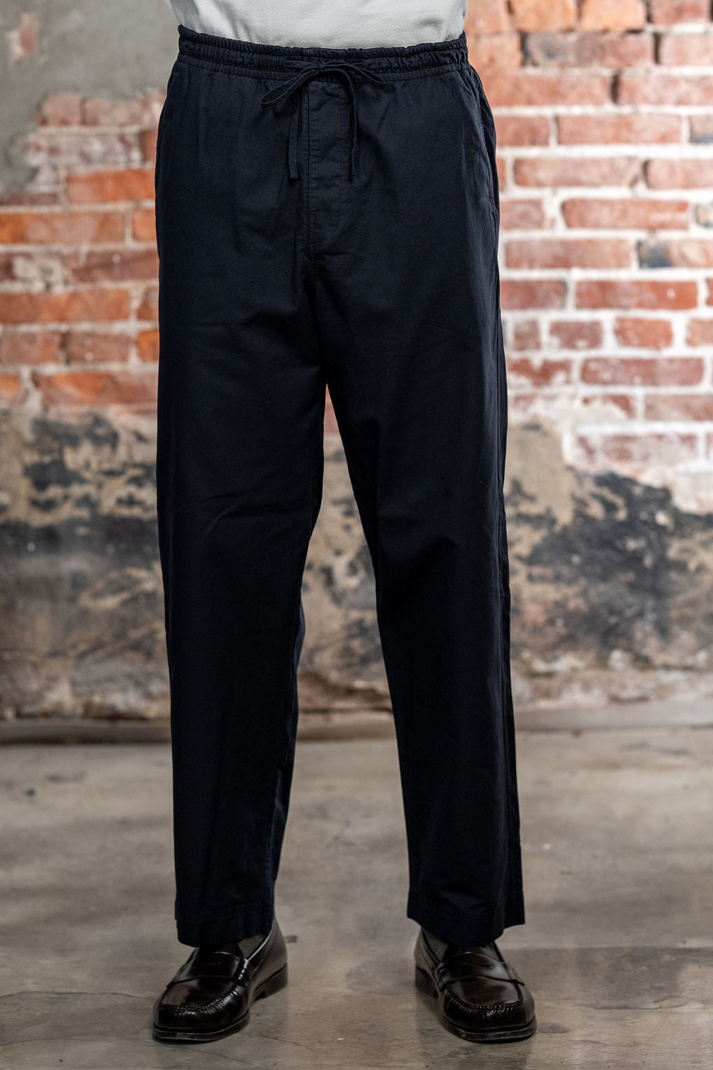 Hansen Garments Jack Casual Drawstring Pants Lava - model shot waist down - brick background - front facing