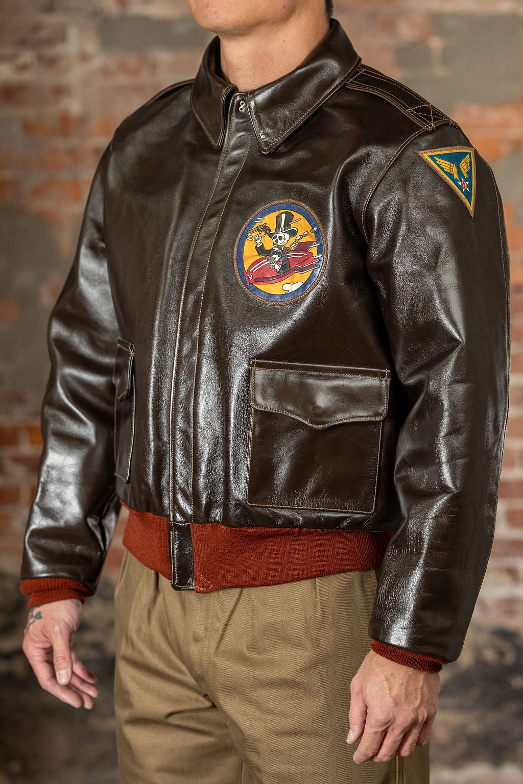 Buzz Rickson's BR80669 Type A-2 - On model, side view with skeleton in plane chest patch and military insignia sleeve patch