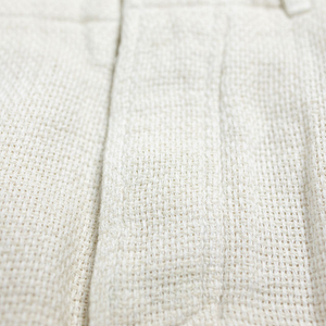 Hansen Garments Bobby Wide Pleated Trousers - Off White Gauze - product shot - close up - detail of button and fabric
