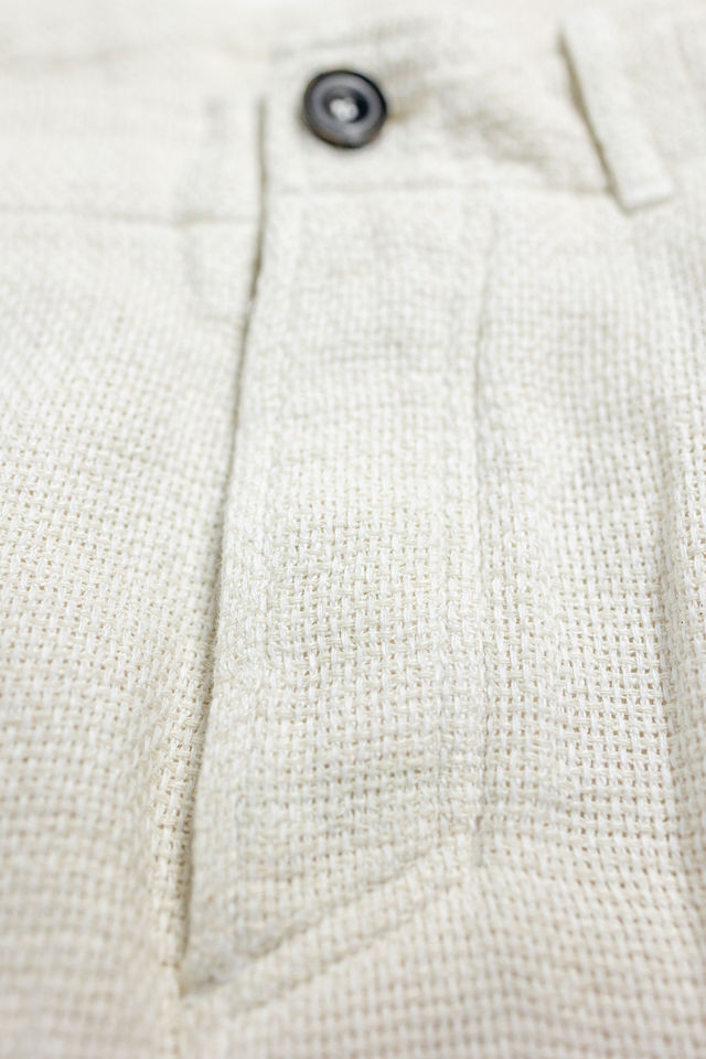 Hansen Garments Bobby Wide Pleated Trousers - Off White Gauze - product shot - close up - detail of button and fabric