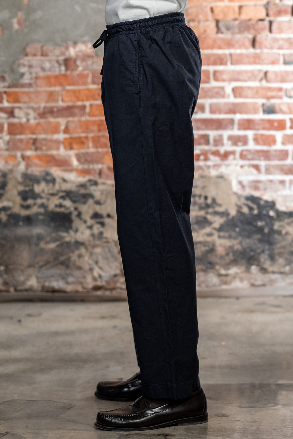 Hansen Garments Jack Casual Drawstring Pants Lava - model shot waist down - brick background - side facing