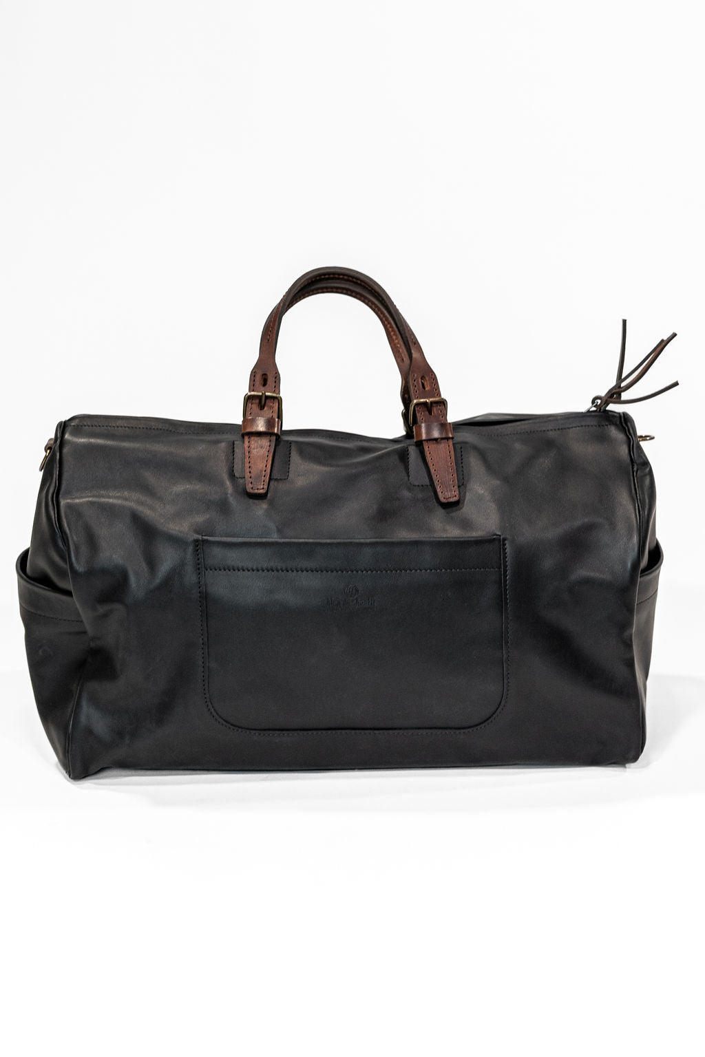 Black leather duffel bag with pockets and brown leather handles front view