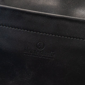 Black duffel bag closeup on embossed bleu de chaeffe logo